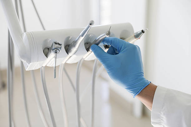 Professional Tooth Extraction technician working in Triangle, VA